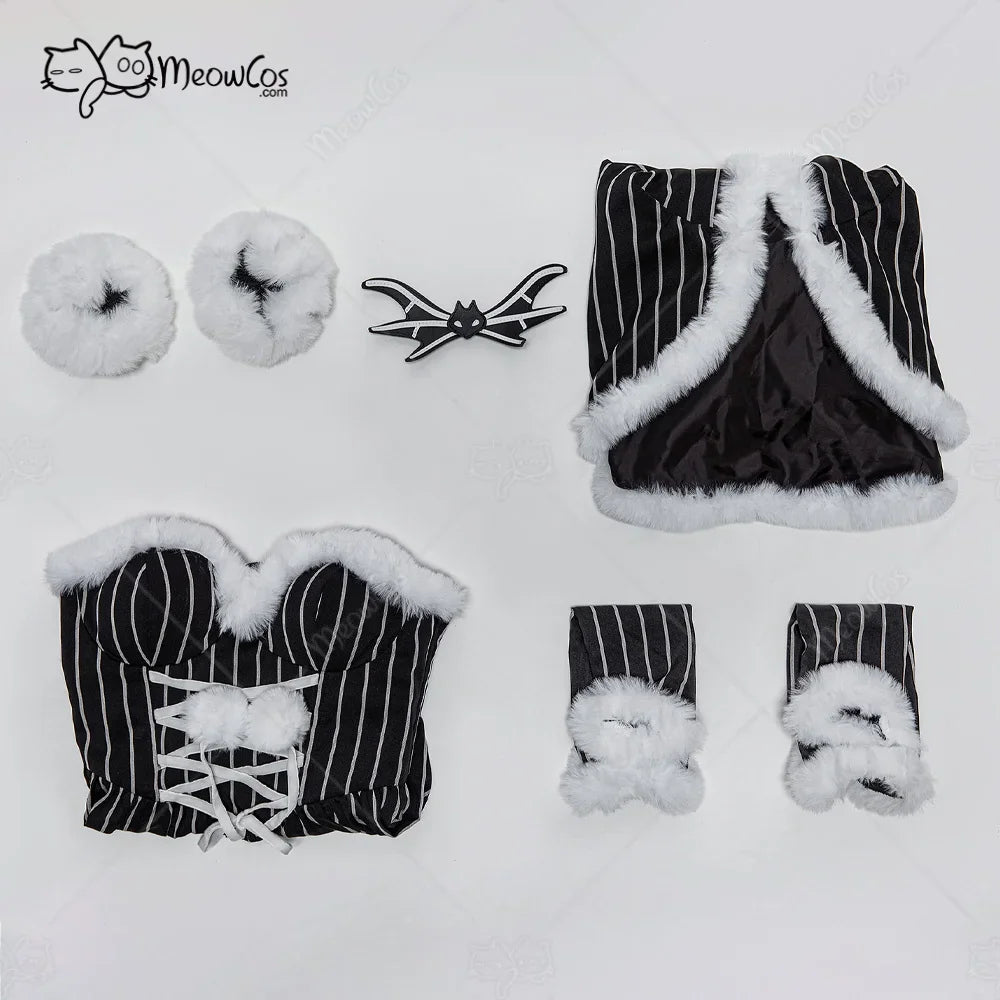 Flat lay of a gothic costume set including a striped corset dress, hooded cloak, sleeves, and accessories