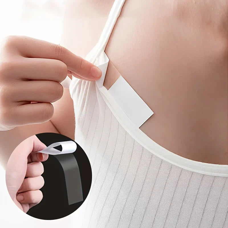 Demonstration of using double-sided clothing tape to secure a white tank top strap to skin