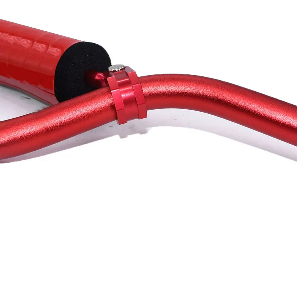 Close-up of a red aluminum motorcycle handlebar with a center pad