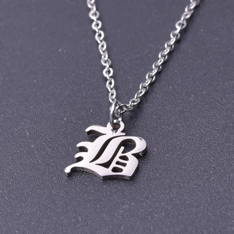 A single silver letter initial necklace on a chain