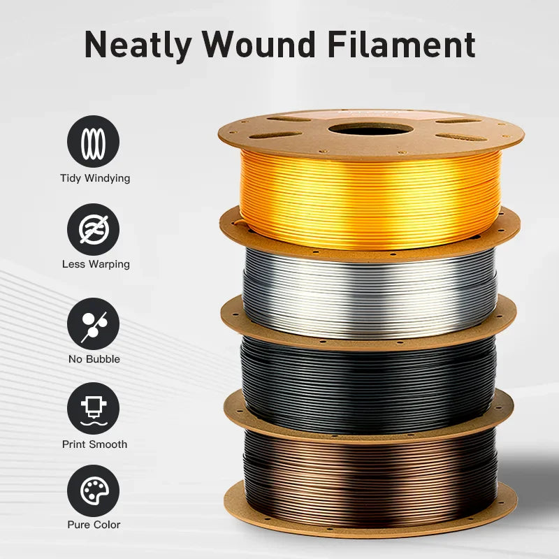 Four stacked spools of 3D printer filament in different colors