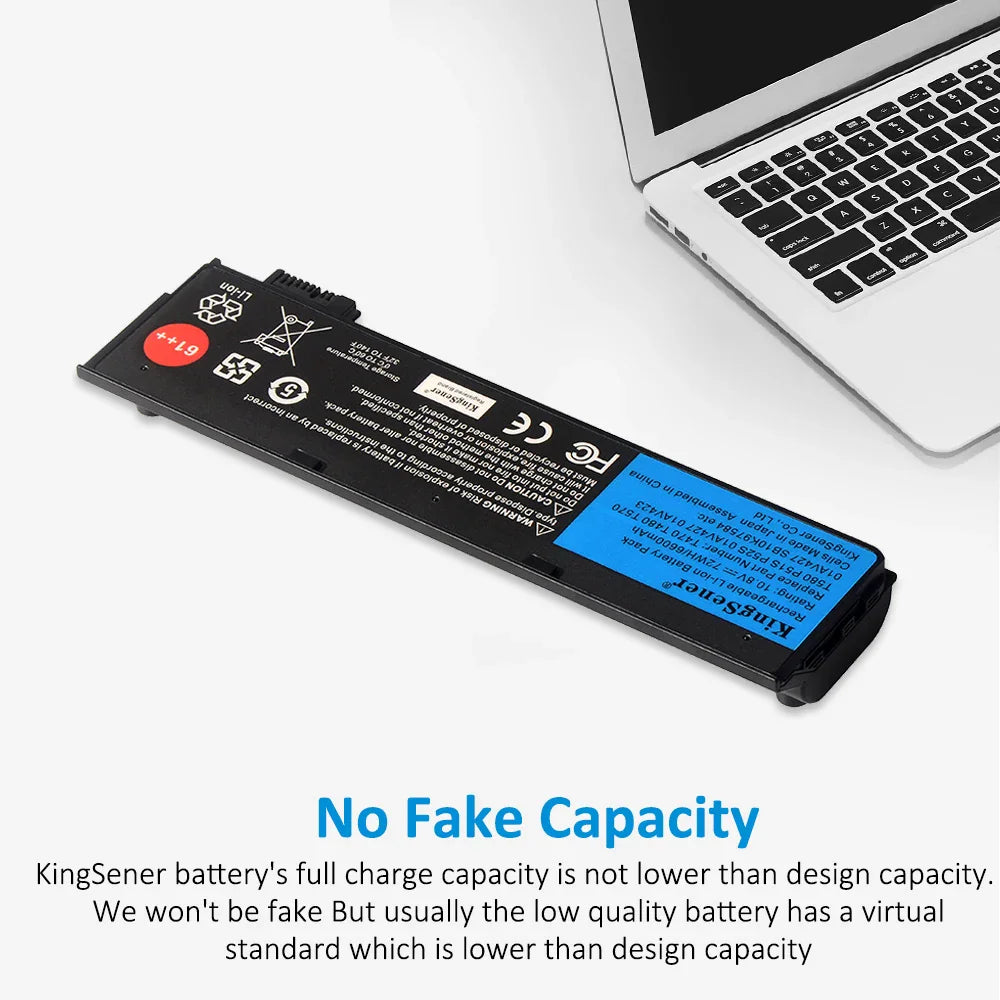 Laptop battery placed next to an open laptop keyboard