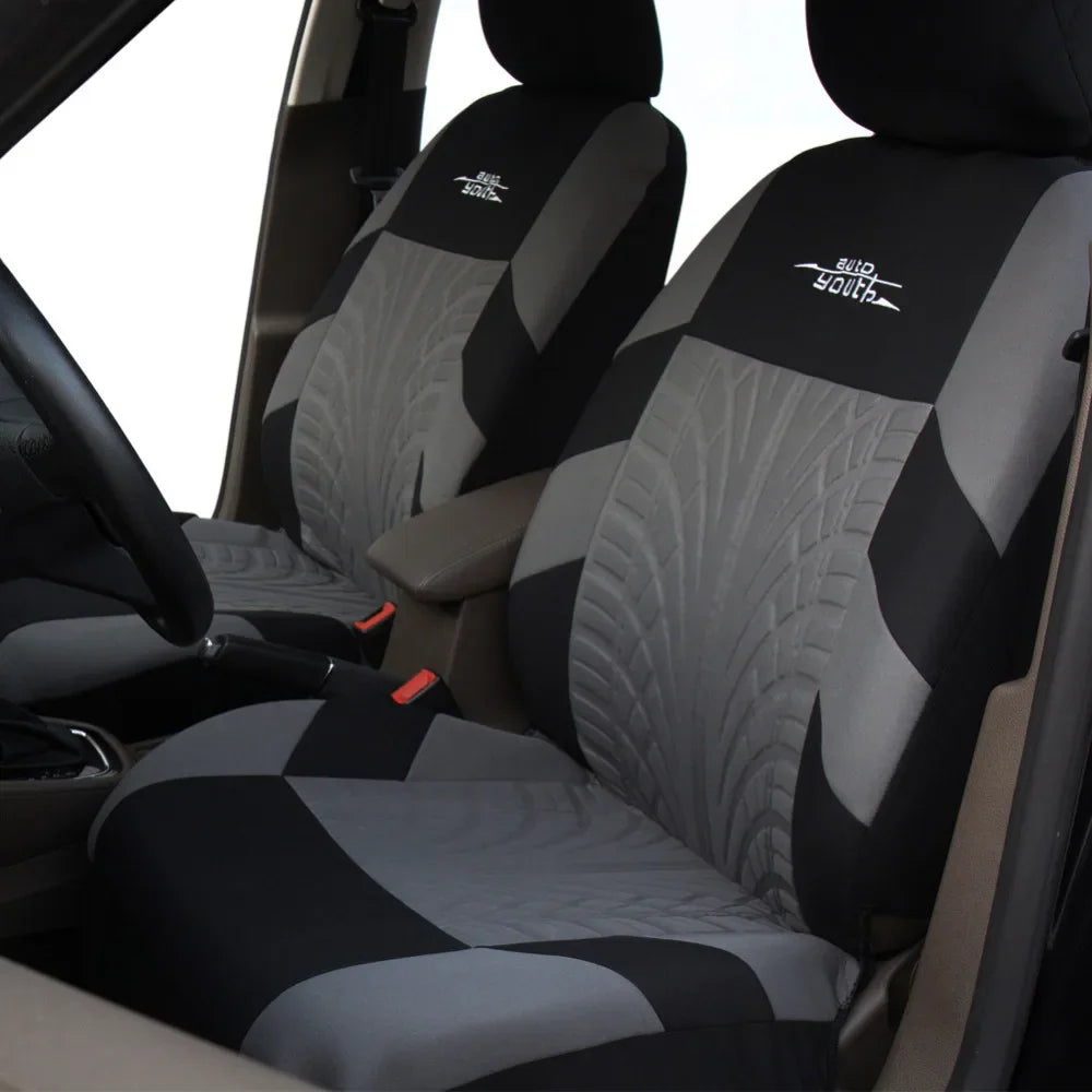 Installed grey and black car seat covers in a vehicle interior