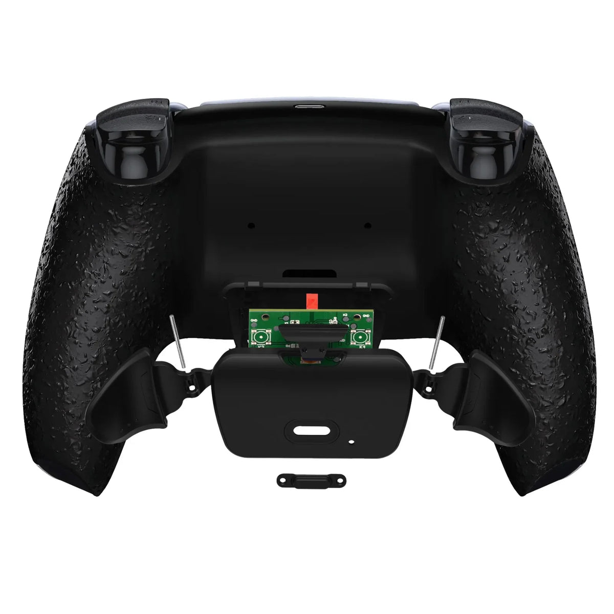 Rear view of a black textured game controller with the back shell partially disassembled to show internal circuit boards