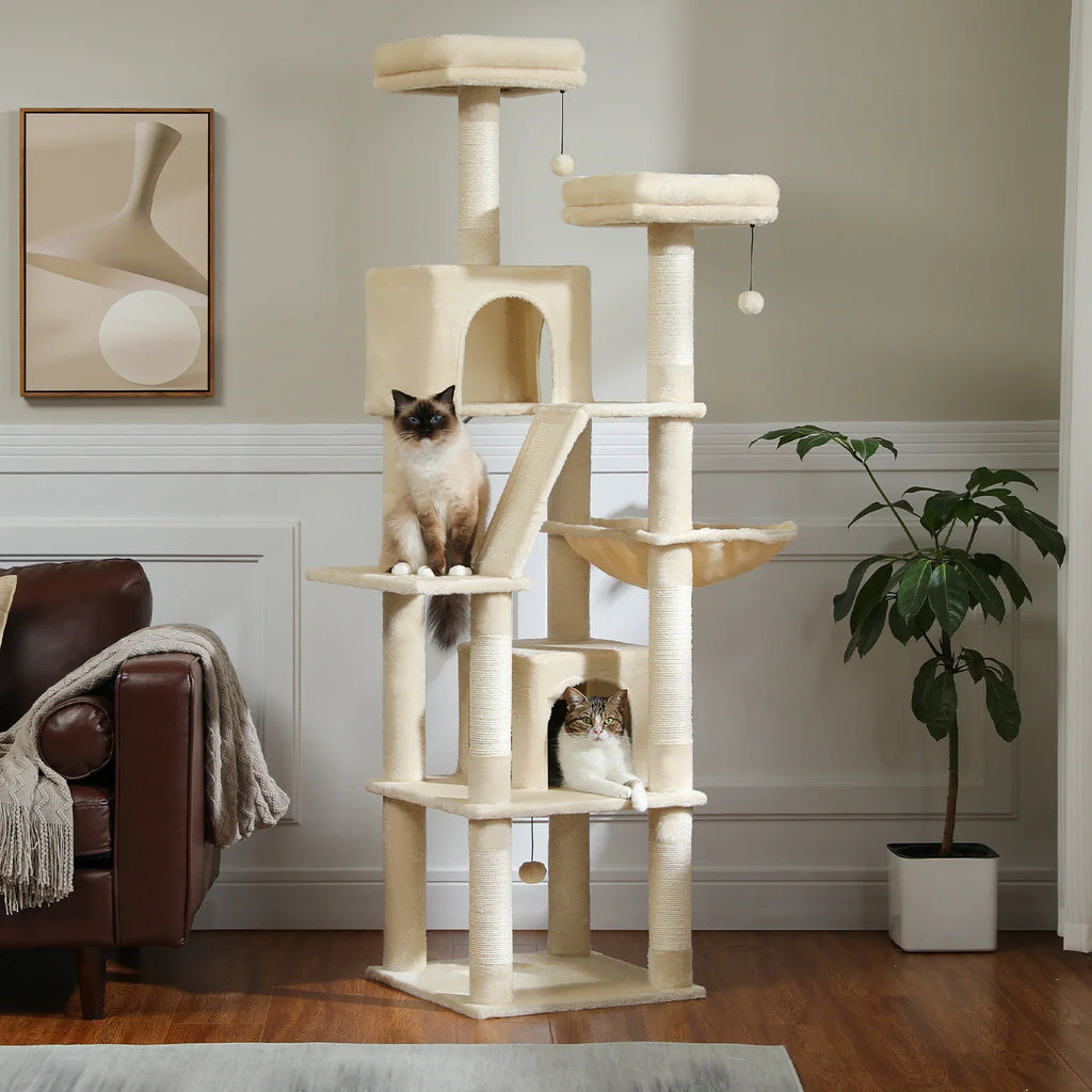 Large multi-level beige plush cat tree tower with scratching posts, perches, and condos with two cats.