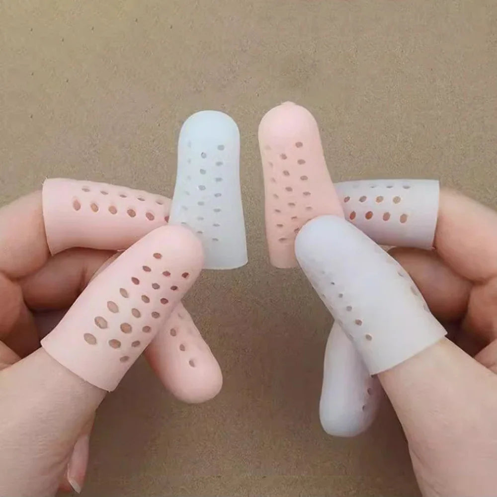 Set of beige and white silicone finger and toe protector caps