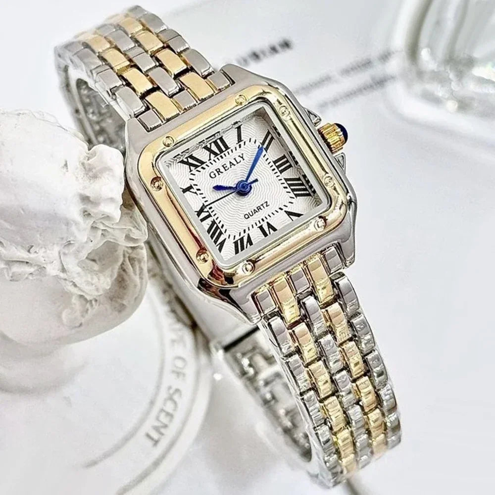 Two-tone silver and gold square quartz watch with a textured white dial and Roman numerals