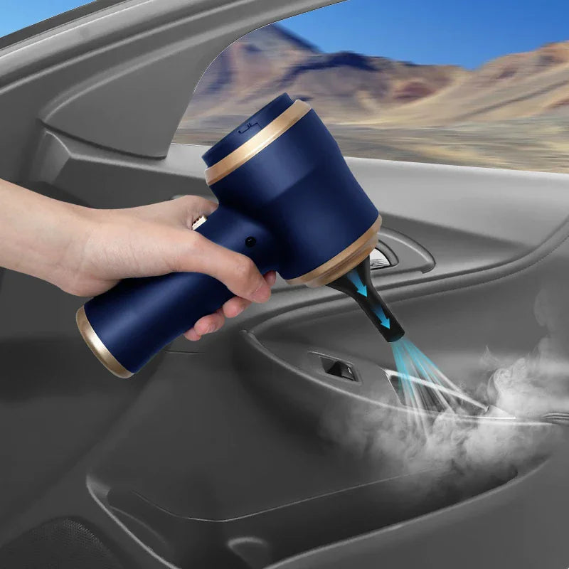 Blue handheld vacuum cleaner being used to blow dust out of a car door interior.