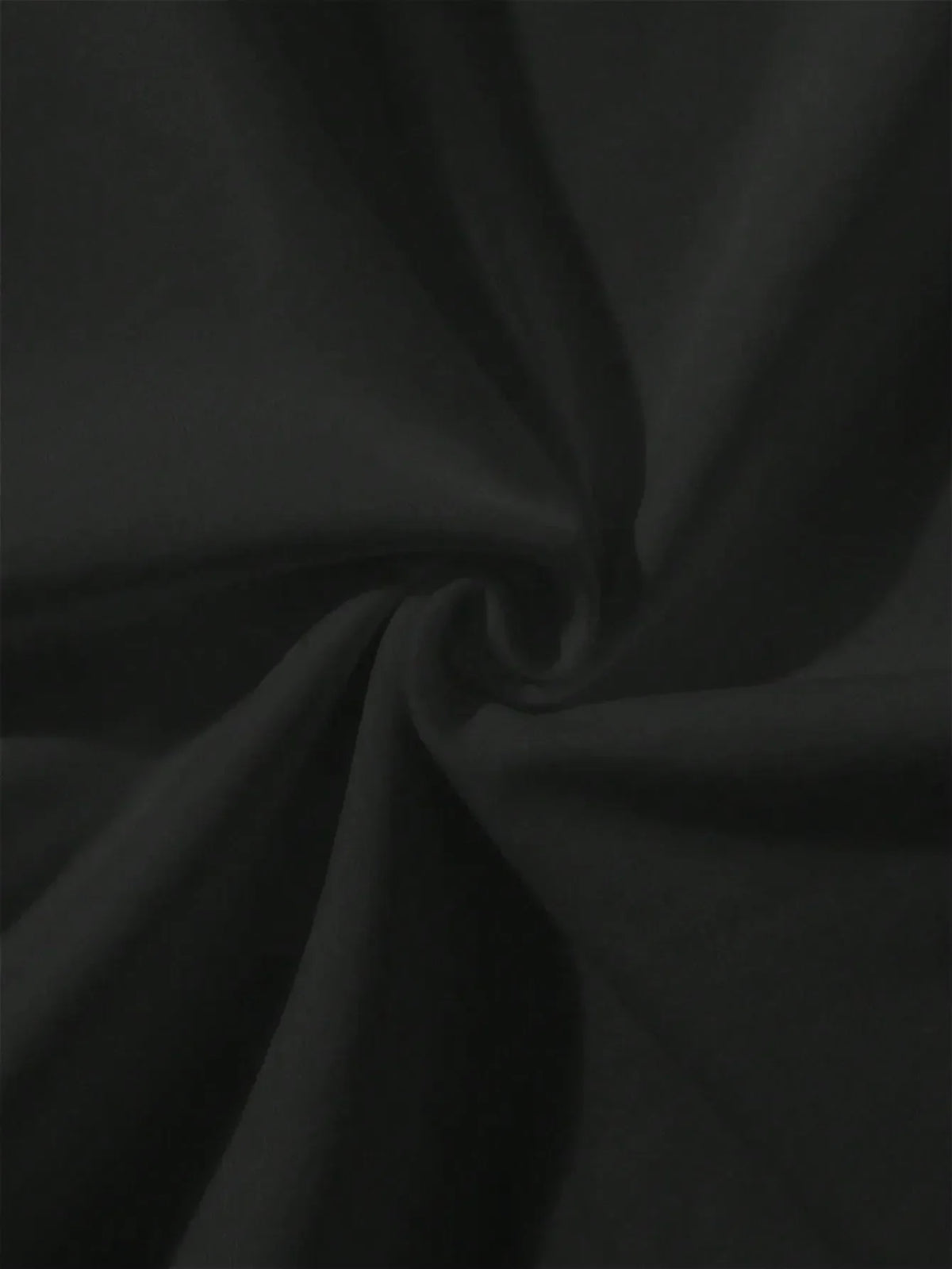 Close-up view of folded black t-shirt fabric texture.