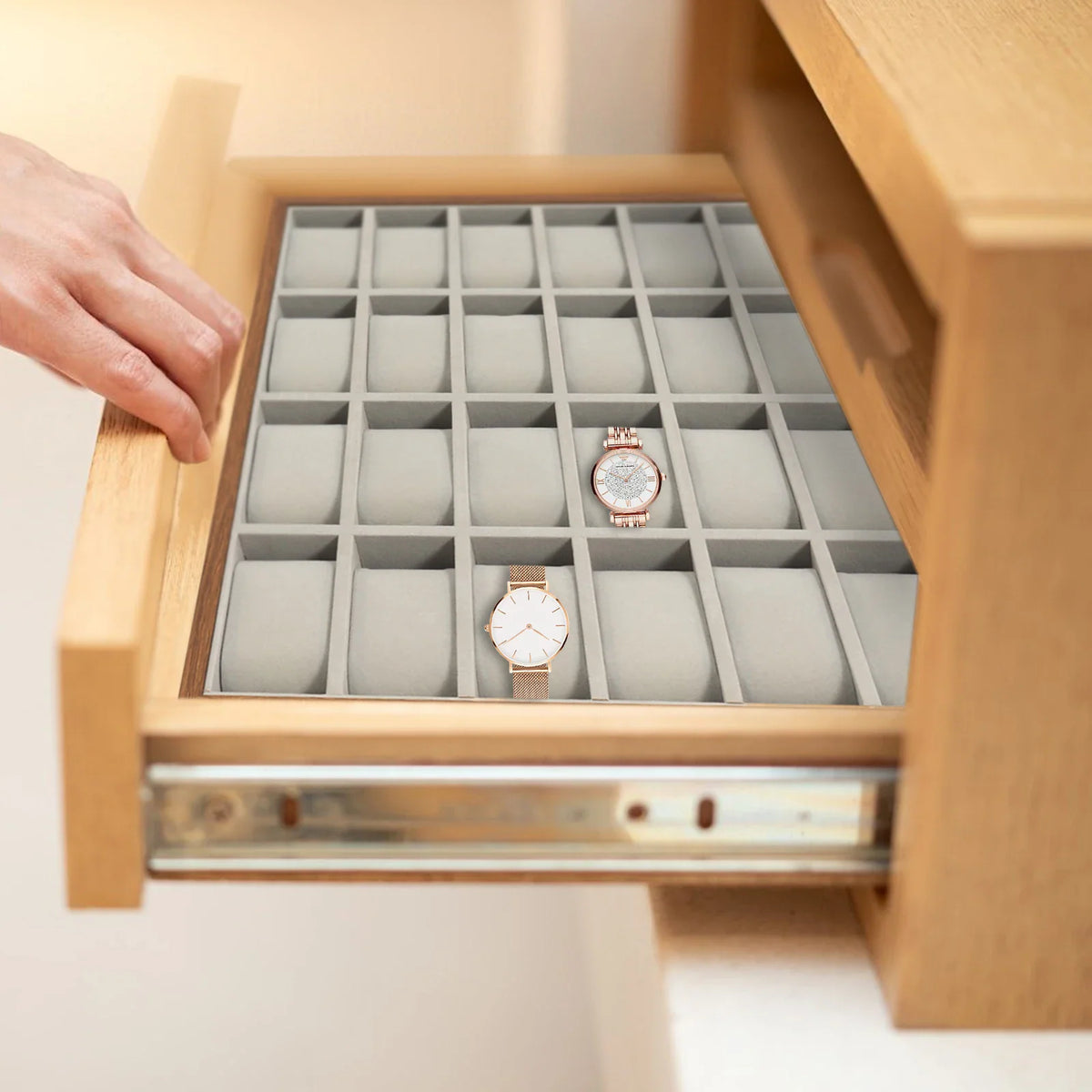 24-slot watch organizer tray with velvet pillows in a wooden drawer