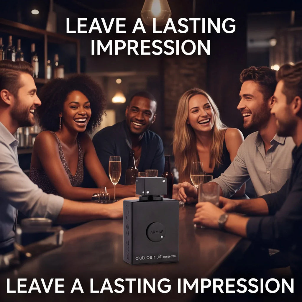 A group of people laughing at a bar with a black cologne bottle in the foreground