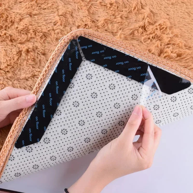 Hands applying a black adhesive rug gripper to the back of a textured mat