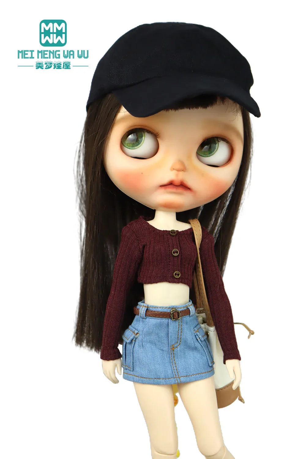 Doll in a black cap, maroon long sleeve cropped knit top, denim miniskirt and bag