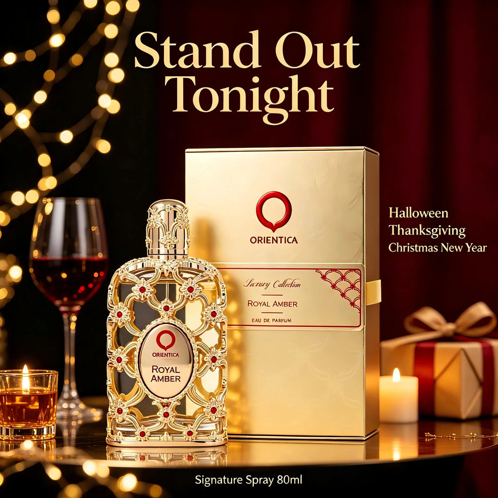 A glass bottle of gold perfume next to its gift box and a glass of red wine on a festive table.