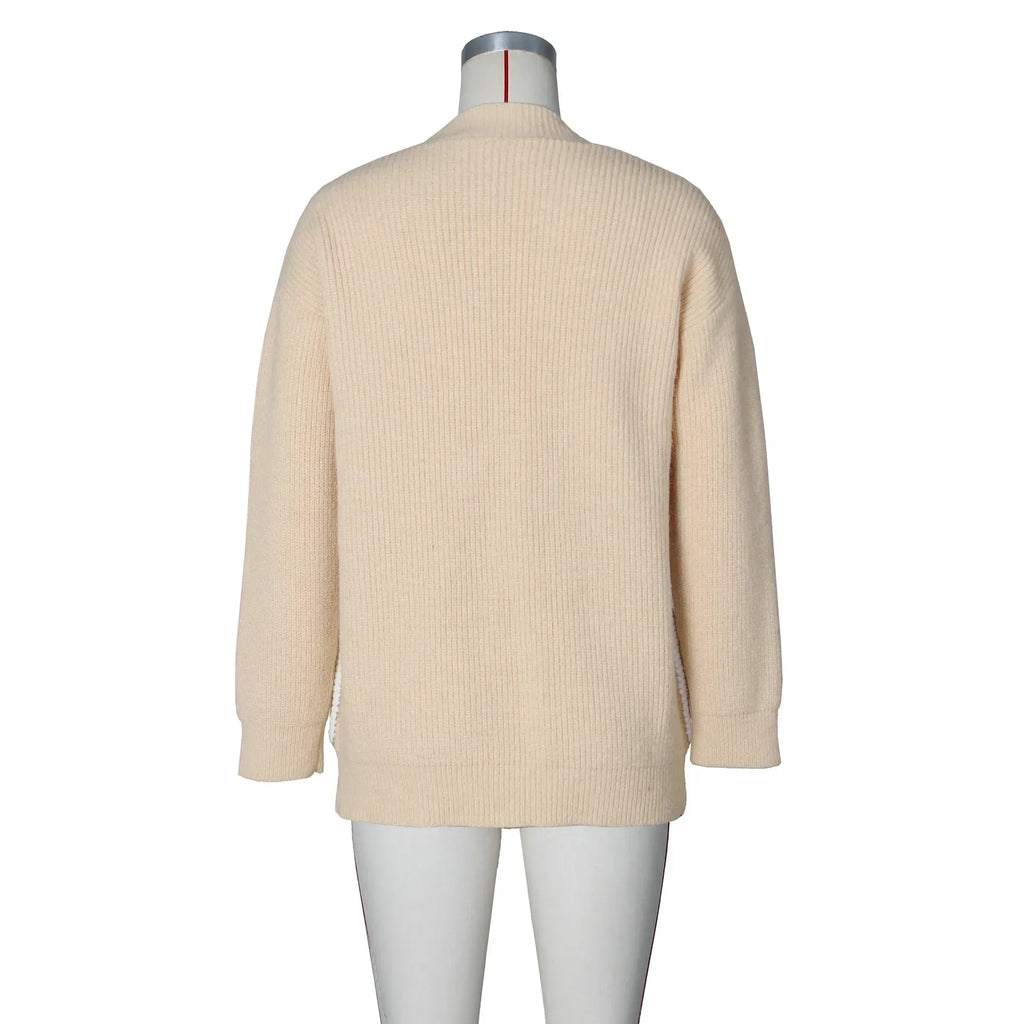 Back view of a plain beige knit cardigan on a mannequin.