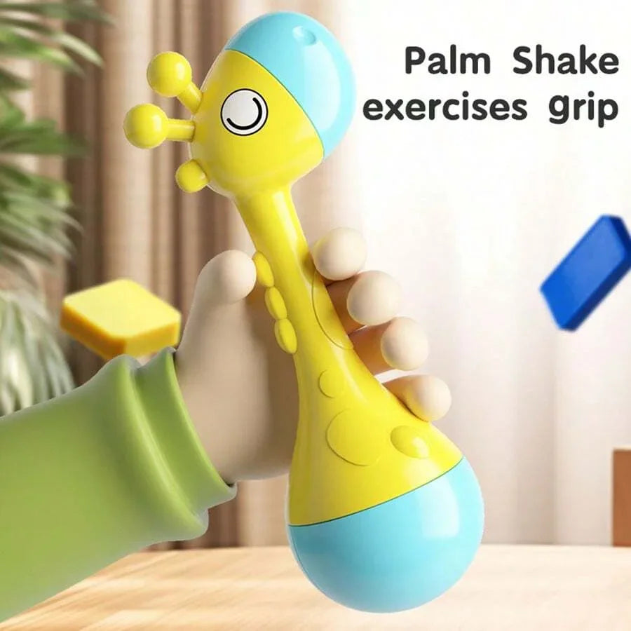 Hand holding a yellow and blue giraffe baby rattle