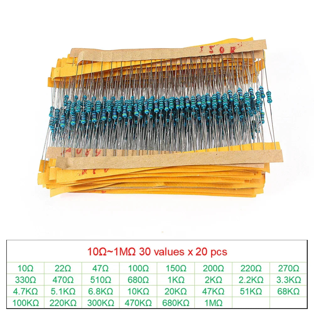 Assorted metal film resistors on yellow paper tape strips with a resistance value reference chart