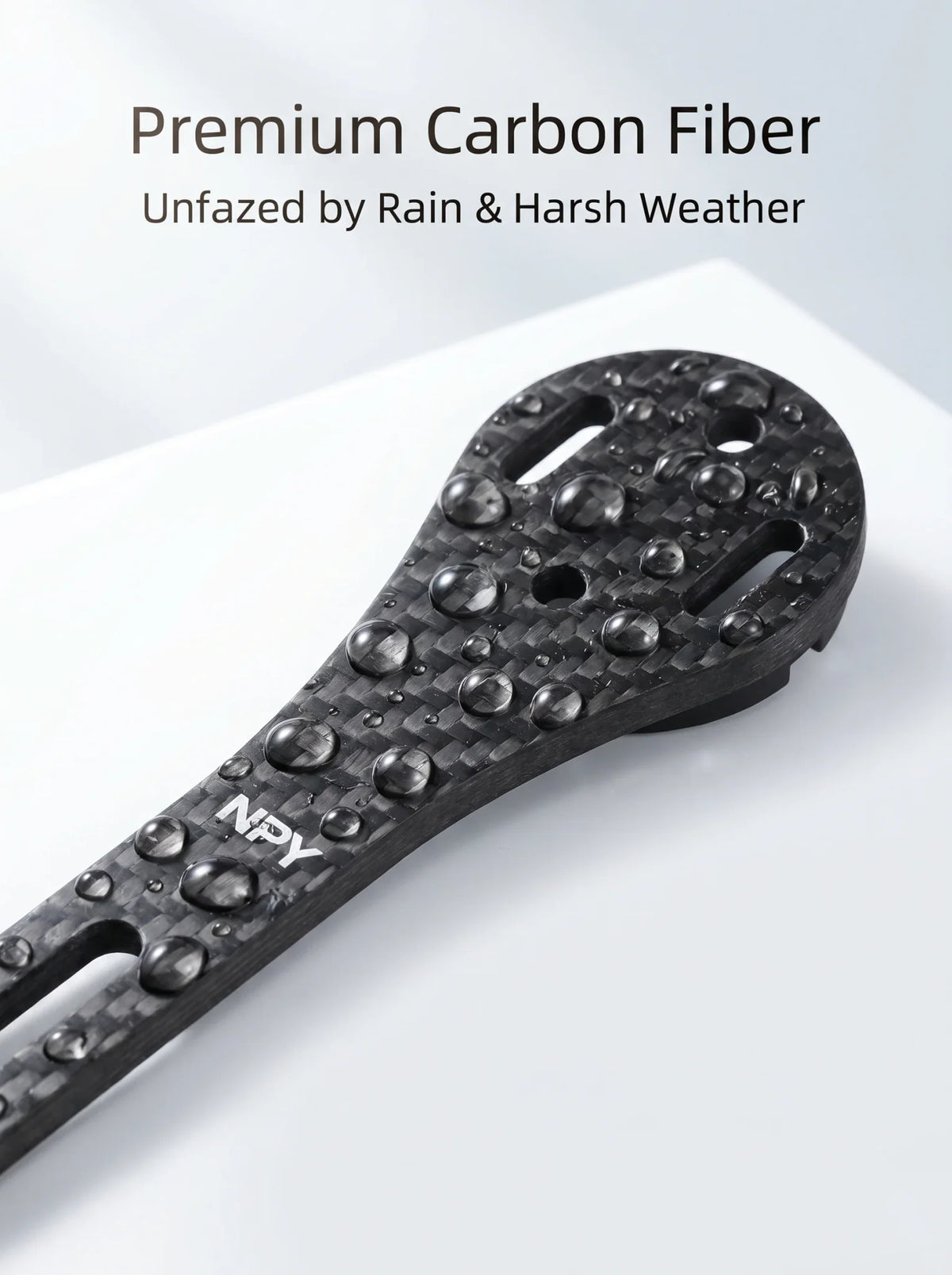 Close-up of premium carbon fiber bicycle computer mount with water droplets