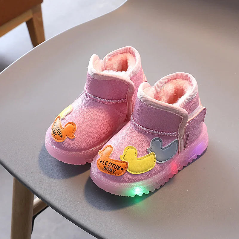 Pair of pink toddler winter boots with fleece lining, duck appliques, and light-up soles