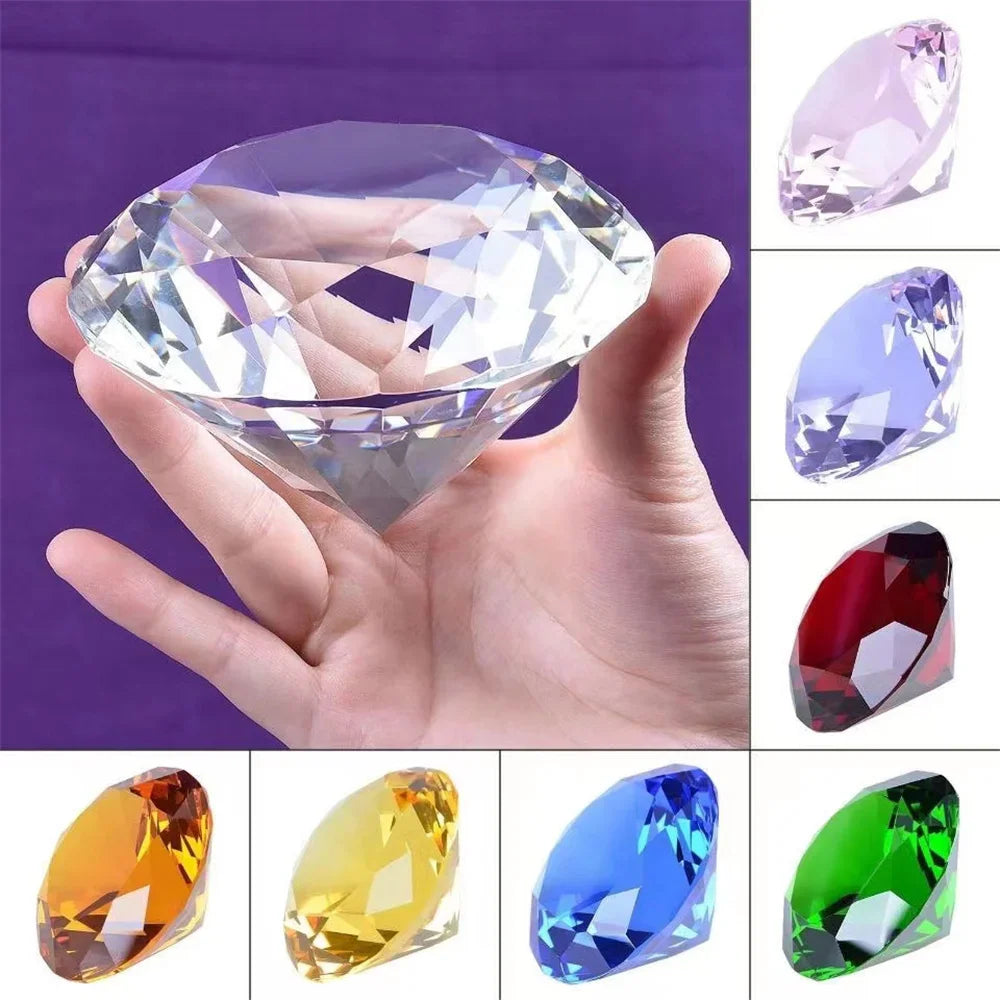 Crystal diamond-shaped paperweight in various colors held in hand