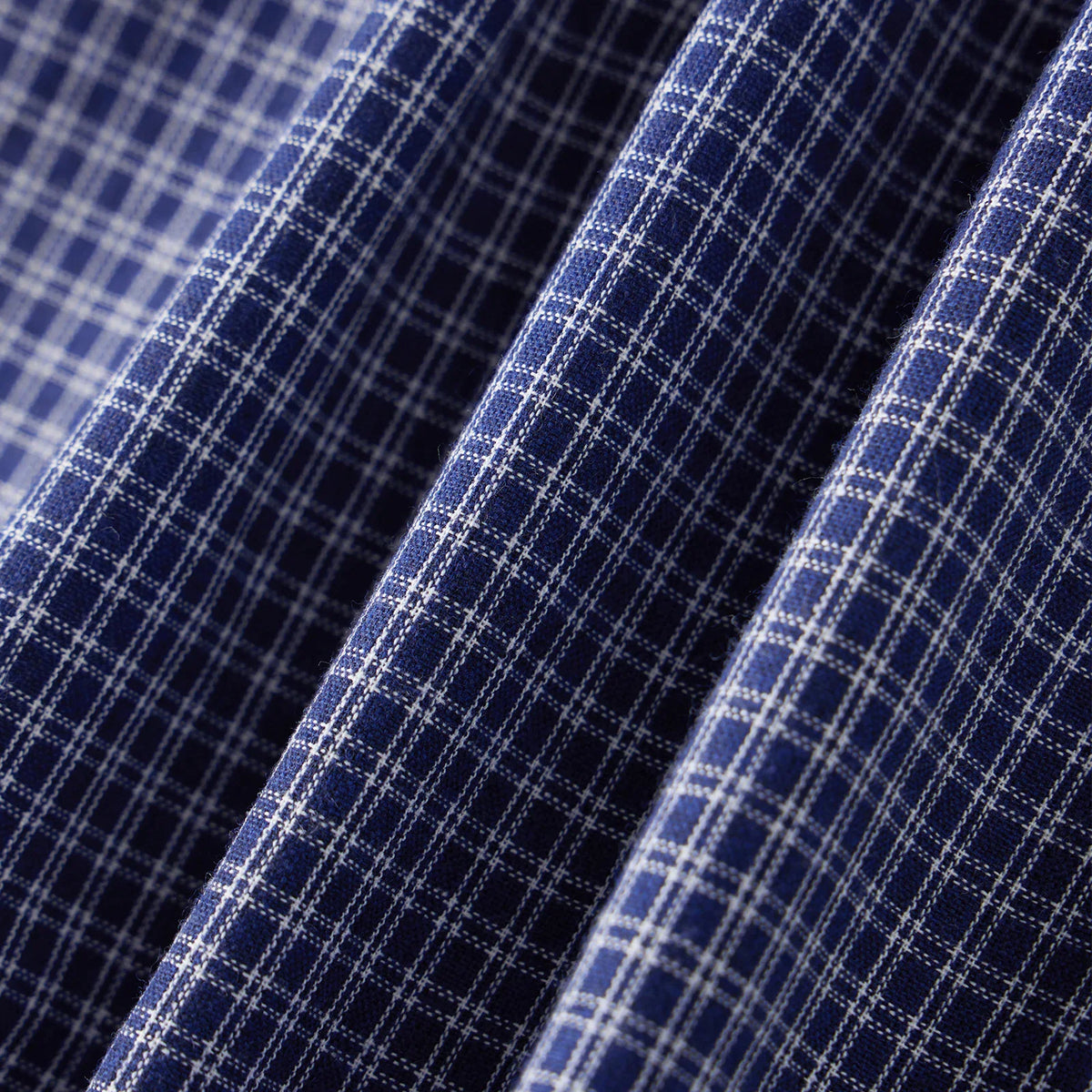 Texture and fabric detail of blue plaid shirt
