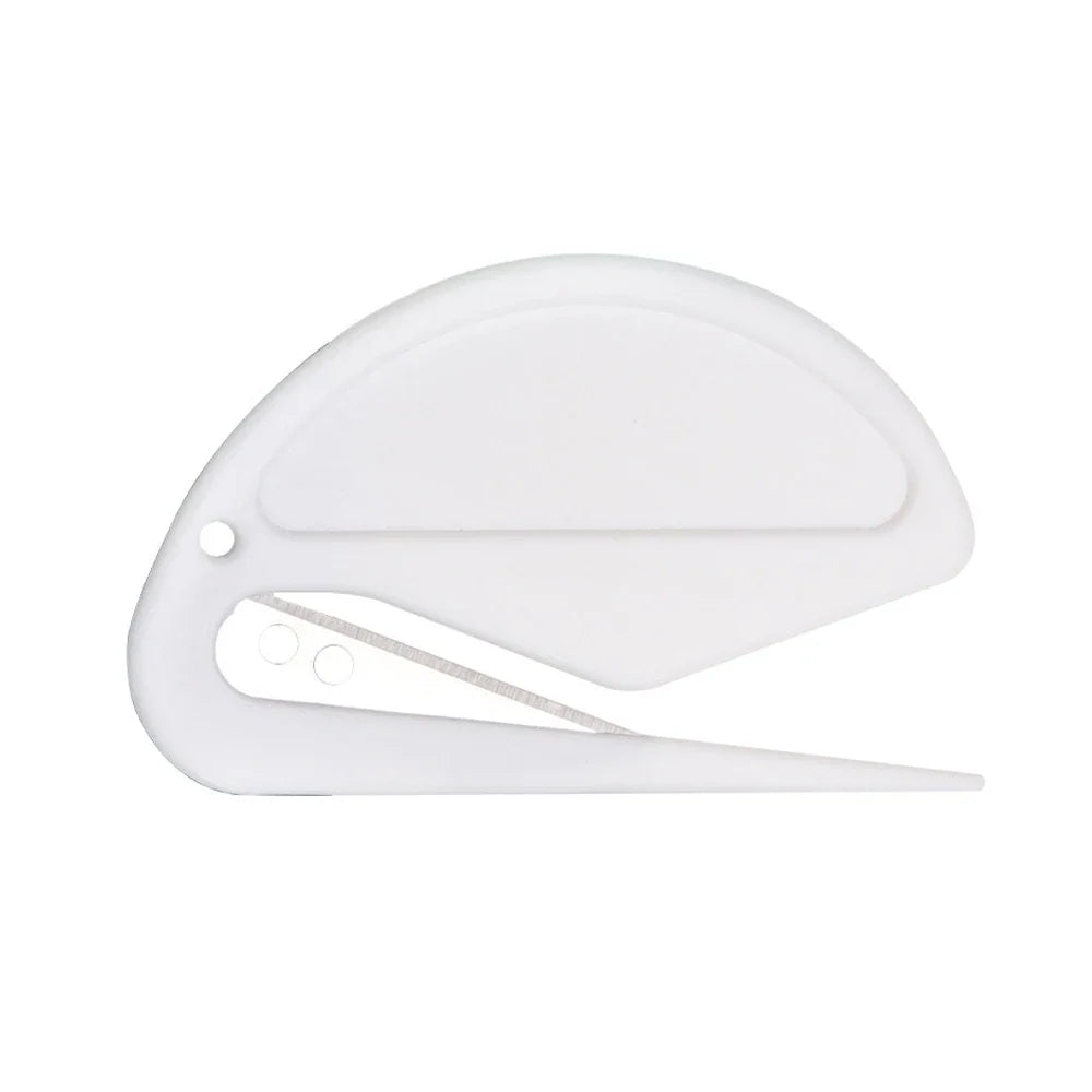 A white double-edged safety letter opener or box cutter.