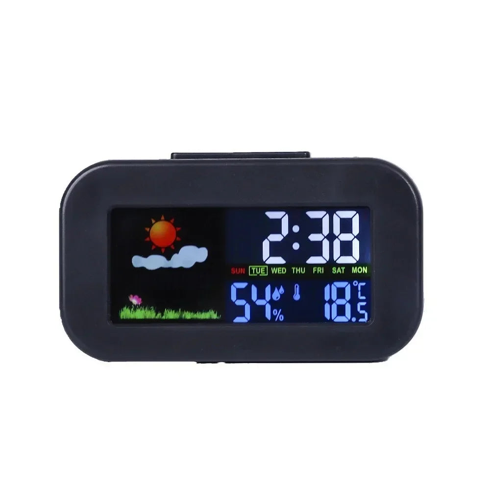 Black digital weather station clock on white background